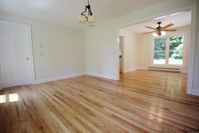 1 Quaker Ridge Rd, Sherman, CT 06784 - unfurnished room featuring a baseboard heating unit, light wood-type flooring, a chandelier, and ceiling fan