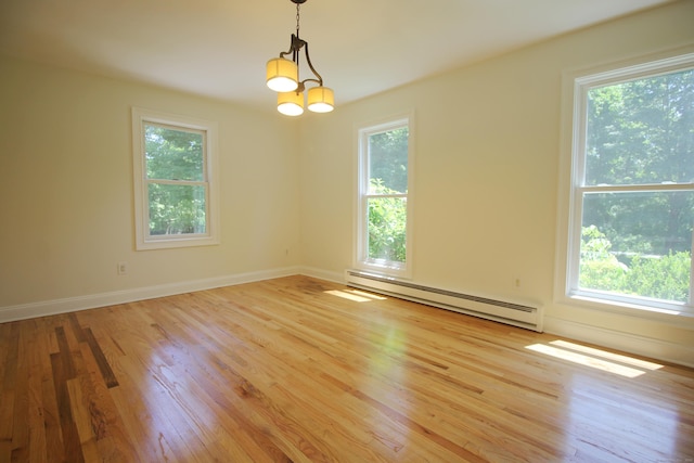 1 Quaker Ridge Rd, Sherman, CT 06784 - spare room featuring a baseboard heating unit, plenty of natural light, and light wood-style floors