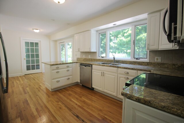 1 Quaker Ridge Rd, Sherman, CT 06784 - kitchen featuring stainless steel dishwasher, light wood-type flooring, backsplash, a peninsula, and white cabinetry