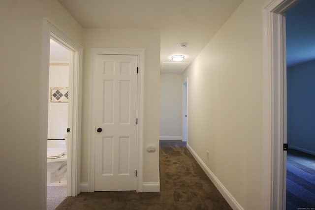 1 Quaker Ridge Rd, Sherman, CT 06784 - corridor with dark colored carpet and baseboards