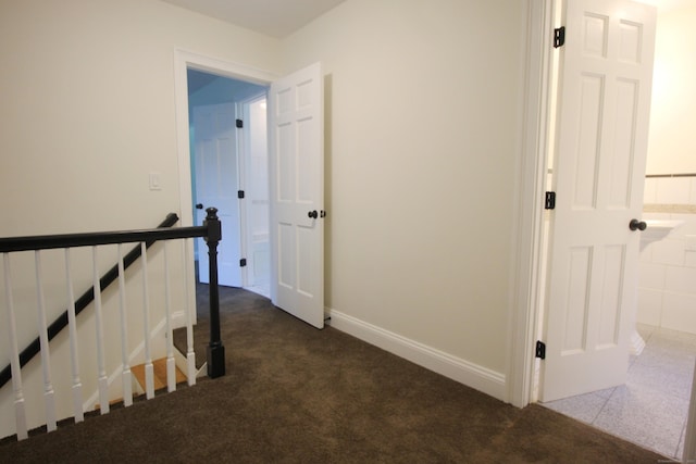 1 Quaker Ridge Rd, Sherman, CT 06784 - corridor with dark carpet and baseboards