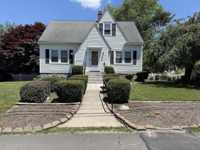 28 Maplerow Ave, Waterbury, CT 06705 - view of front of house with a chimney and a shingled roof