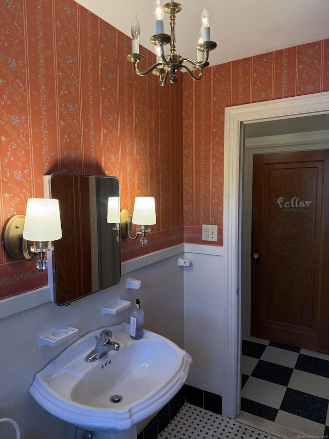28 Maplerow Ave, Waterbury, CT 06705 - bathroom featuring a chandelier and a wainscoted wall