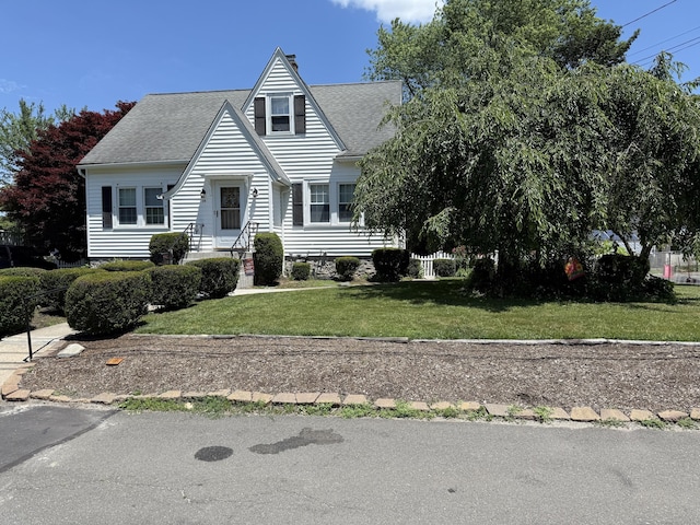 28 Maplerow Ave, Waterbury, CT 06705 - view of front of house with a shingled roof and a front lawn