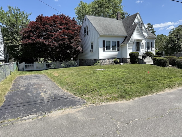 28 Maplerow Ave, Waterbury, CT 06705 - view of front of home featuring roof with shingles and a chimney