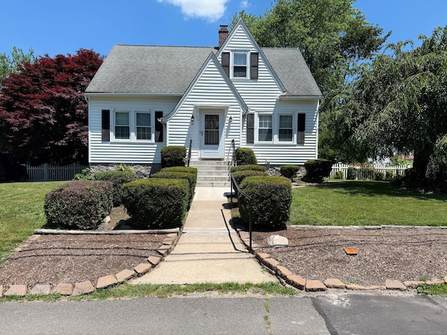 28 Maplerow Ave, Waterbury, CT 06705 - view of front facade featuring a chimney and roof with shingles