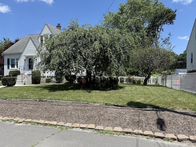 28 Maplerow Ave, Waterbury, CT 06705 - view of front of house featuring a chimney and a shingled roof