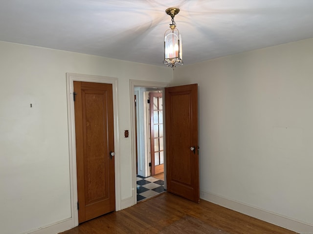 28 Maplerow Ave, Waterbury, CT 06705 - empty room with wood finished floors and baseboards