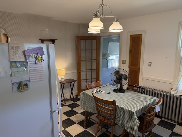 28 Maplerow Ave, Waterbury, CT 06705 - dining space featuring light flooring and radiator heating unit