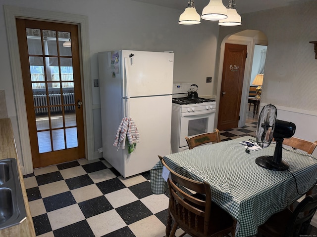 28 Maplerow Ave, Waterbury, CT 06705 - dining area featuring light flooring and arched walkways