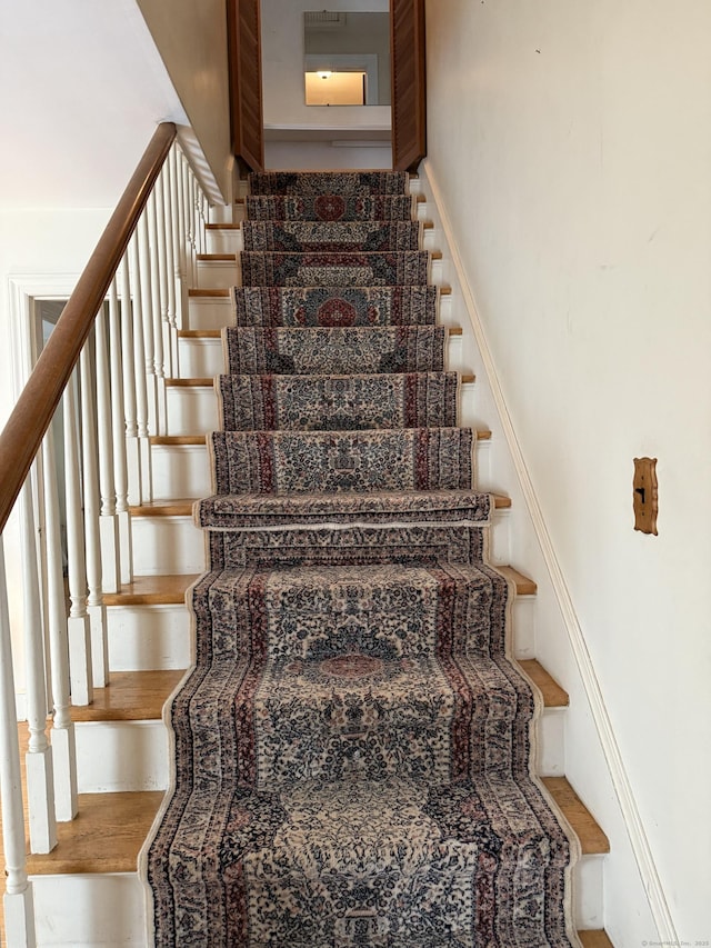28 Maplerow Ave, Waterbury, CT 06705 - staircase featuring wood finished floors