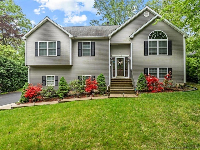 126 Conrad Dr, New Haven, CT 06515 - split foyer home featuring a front lawn and a shingled roof