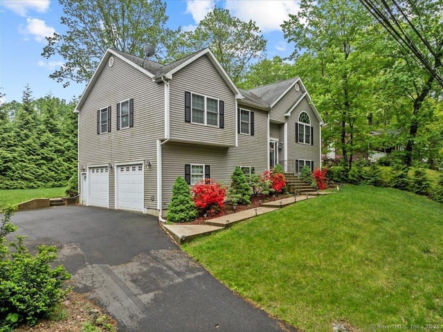 126 Conrad Dr, New Haven, CT 06515 - bi-level home featuring driveway, a garage, and a front yard