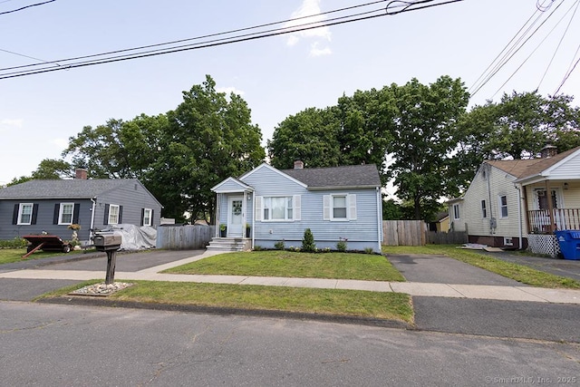 18 Hull Dr, Southington, CT 06479 - view of front of home with a chimney and driveway