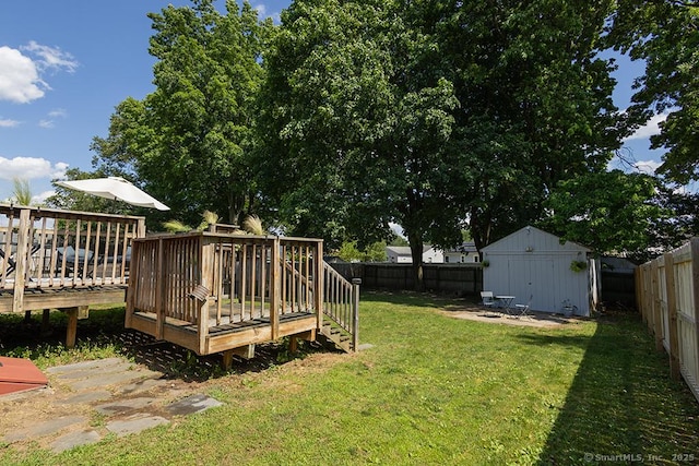 18 Hull Dr, Southington, CT 06479 - fenced backyard featuring a deck and a storage unit