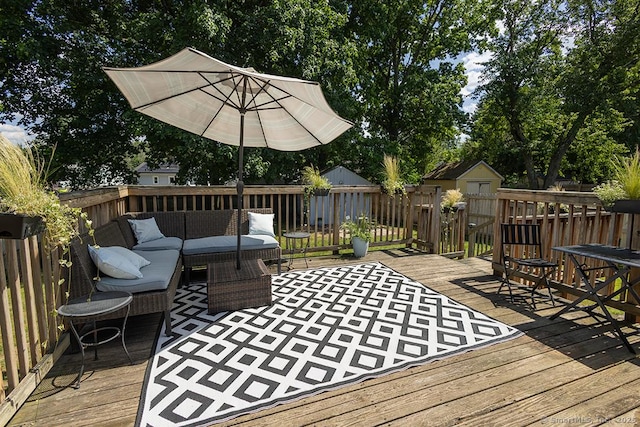 18 Hull Dr, Southington, CT 06479 - wooden deck featuring an outdoor hangout area, a storage unit, and view of wooded area