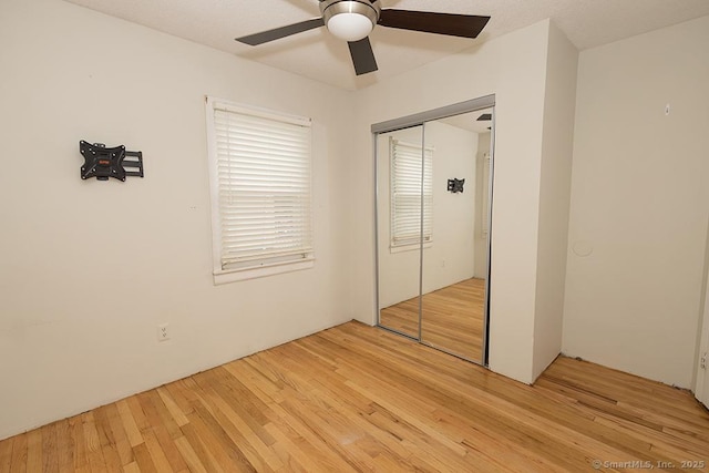18 Hull Dr, Southington, CT 06479 - unfurnished bedroom with light wood-style flooring, a closet, and ceiling fan