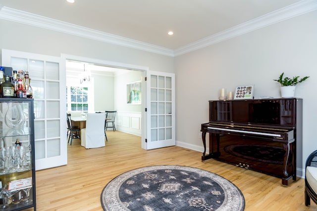 81 Salem Rd, Trumbull, CT 06611 - sitting room with french doors, ornamental molding, wood finished floors, recessed lighting, and a chandelier