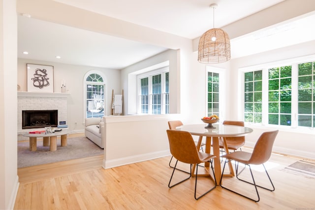81 Salem Rd, Trumbull, CT 06611 - dining space with light wood finished floors, a brick fireplace, and recessed lighting
