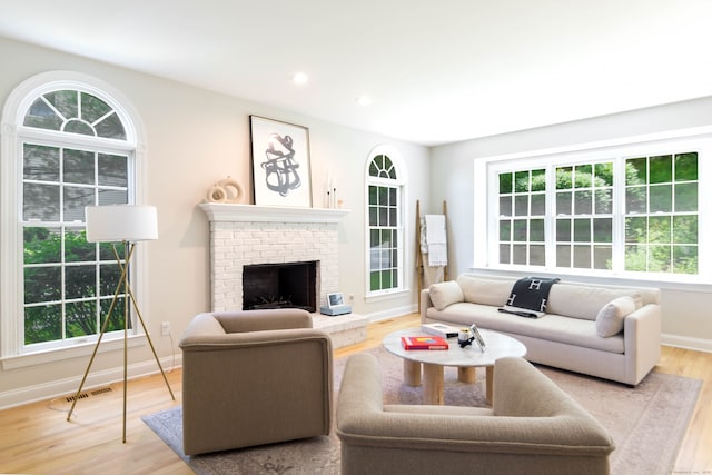 81 Salem Rd, Trumbull, CT 06611 - living room featuring healthy amount of natural light, wood finished floors, a fireplace, and recessed lighting