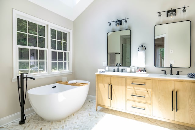 81 Salem Rd, Trumbull, CT 06611 - bathroom featuring double vanity, a freestanding bath, and vaulted ceiling