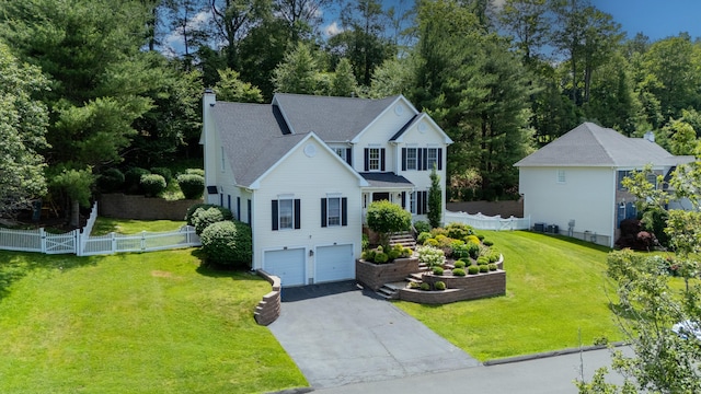 81 Salem Rd, Trumbull, CT 06611 - traditional-style home featuring asphalt driveway, an attached garage, and view of wooded area