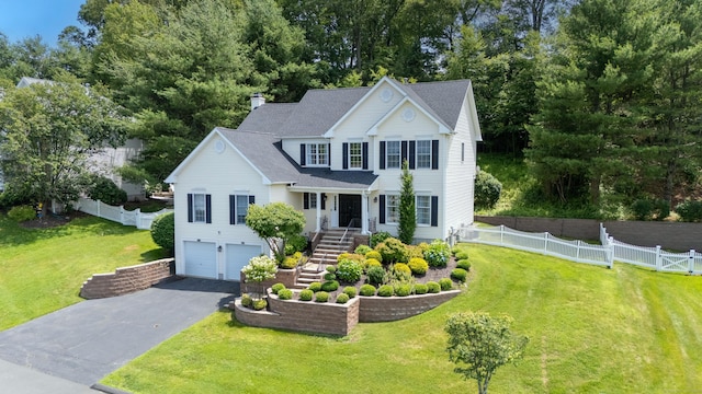 81 Salem Rd, Trumbull, CT 06611 - view of front of house with asphalt driveway, a garage, stairway, roof with shingles, and a chimney