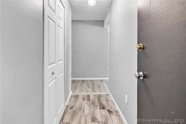 175 Mill Pond Rd Unit 203, Hamden, CT 06514 - hallway featuring wood finished floors and baseboards