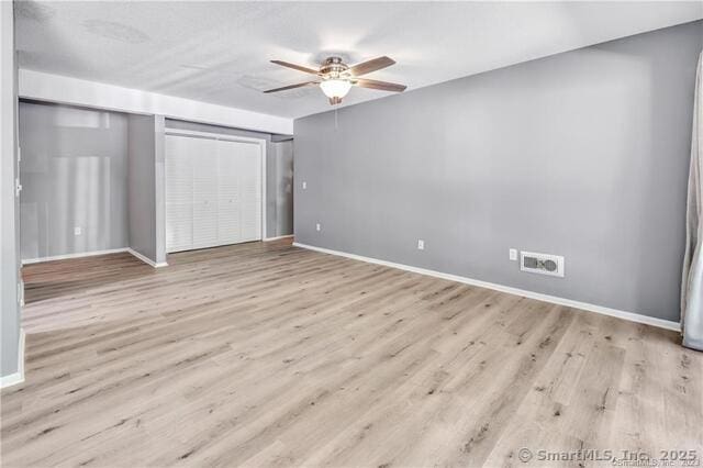 175 Mill Pond Rd Unit 203, Hamden, CT 06514 - unfurnished bedroom featuring wood finished floors and ceiling fan