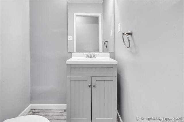175 Mill Pond Rd Unit 203, Hamden, CT 06514 - half bath featuring vanity and wood finished floors