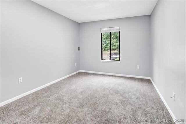 175 Mill Pond Rd Unit 203, Hamden, CT 06514 - spare room featuring carpet floors and baseboards