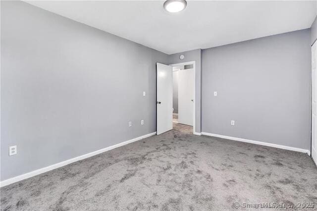 175 Mill Pond Rd Unit 203, Hamden, CT 06514 - unfurnished bedroom with carpet and baseboards