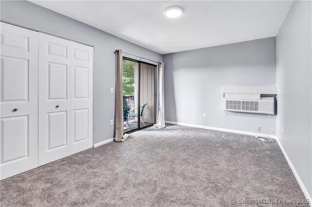 175 Mill Pond Rd Unit 203, Hamden, CT 06514 - unfurnished bedroom featuring carpet floors and access to outside