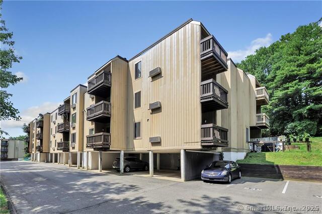 175 Mill Pond Rd Unit 203, Hamden, CT 06514 - view of apartment building / complex with parking