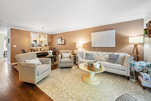 250 Summer St Unit 29, Southington, CT 06479 - living room featuring crown molding, wood finished floors, and a chandelier