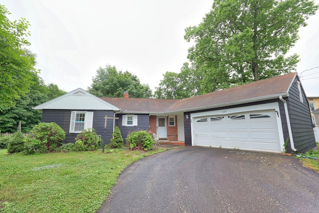 120 Knowles Ave, Southington, CT 06479 - ranch-style house featuring asphalt driveway, an attached garage, a front yard, and brick siding