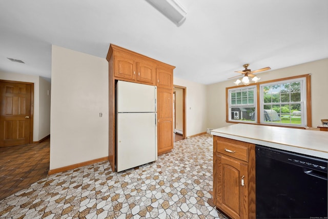 120 Knowles Ave, Southington, CT 06479 - kitchen with black dishwasher, freestanding refrigerator, light countertops, a baseboard radiator, and a ceiling fan
