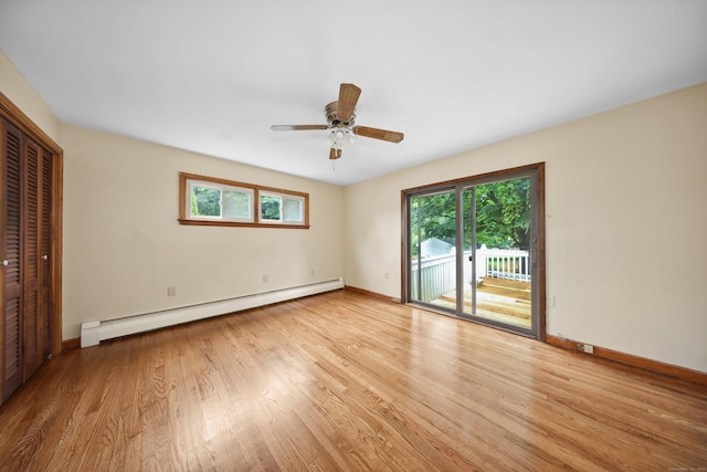 120 Knowles Ave, Southington, CT 06479 - unfurnished bedroom with a baseboard radiator, access to exterior, multiple windows, and light wood-style flooring