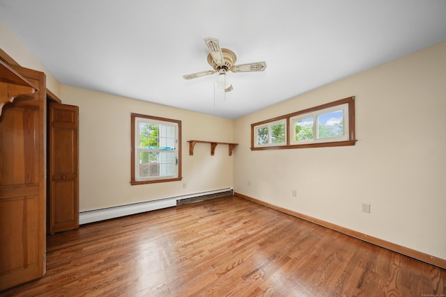120 Knowles Ave, Southington, CT 06479 - unfurnished bedroom with a baseboard radiator, light wood-style flooring, and ceiling fan
