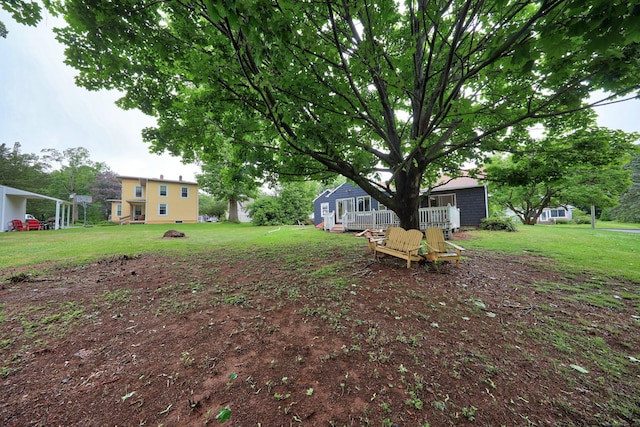 120 Knowles Ave, Southington, CT 06479 - view of green lawn with a wooden deck and a fire pit