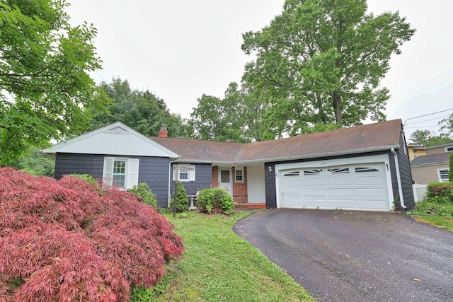 120 Knowles Ave, Southington, CT 06479 - ranch-style house with driveway, an attached garage, brick siding, and a chimney