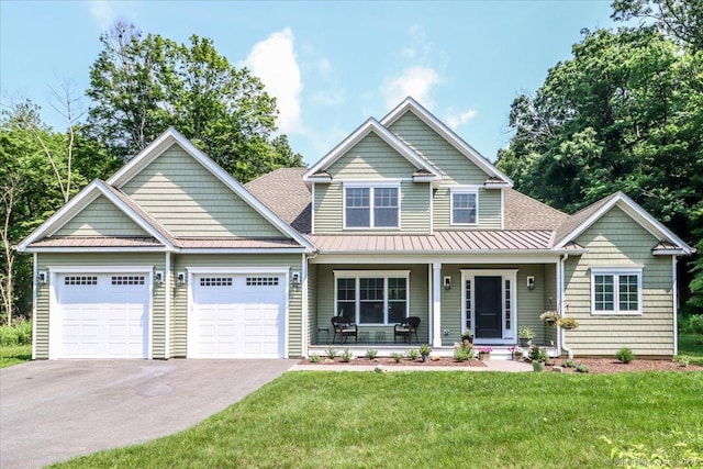 11 Tall Oaks Dr Unit 11, New Milford, CT 06776 - view of front of house with covered porch, a standing seam roof, asphalt driveway, and an attached garage