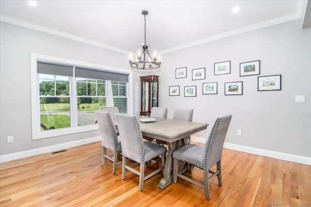 11 Tall Oaks Dr Unit 11, New Milford, CT 06776 - dining area featuring a chandelier, light wood-style floors, and crown molding