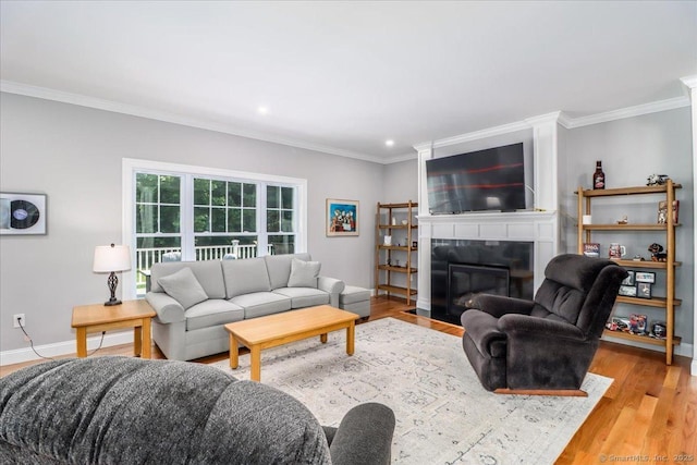 11 Tall Oaks Dr Unit 11, New Milford, CT 06776 - living area featuring ornamental molding, a fireplace with flush hearth, light wood-type flooring, and recessed lighting