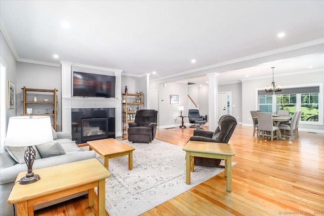 11 Tall Oaks Dr Unit 11, New Milford, CT 06776 - living room featuring light wood-style flooring, a glass covered fireplace, recessed lighting, a chandelier, and stairway