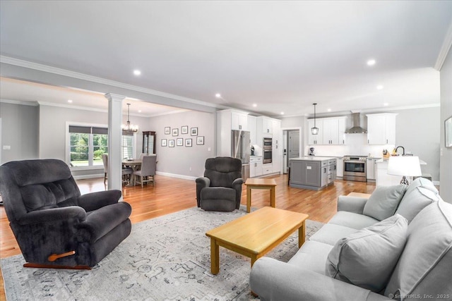 11 Tall Oaks Dr Unit 11, New Milford, CT 06776 - living room featuring light wood-style flooring, a chandelier, recessed lighting, and crown molding
