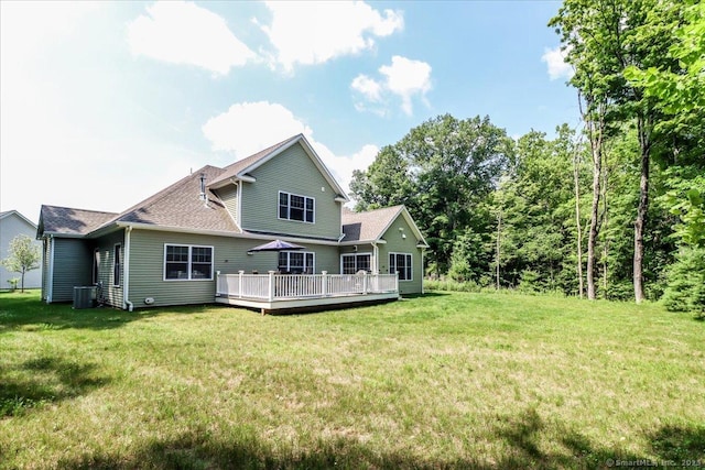 11 Tall Oaks Dr Unit 11, New Milford, CT 06776 - back of property with a wooden deck, a lawn, and a shingled roof