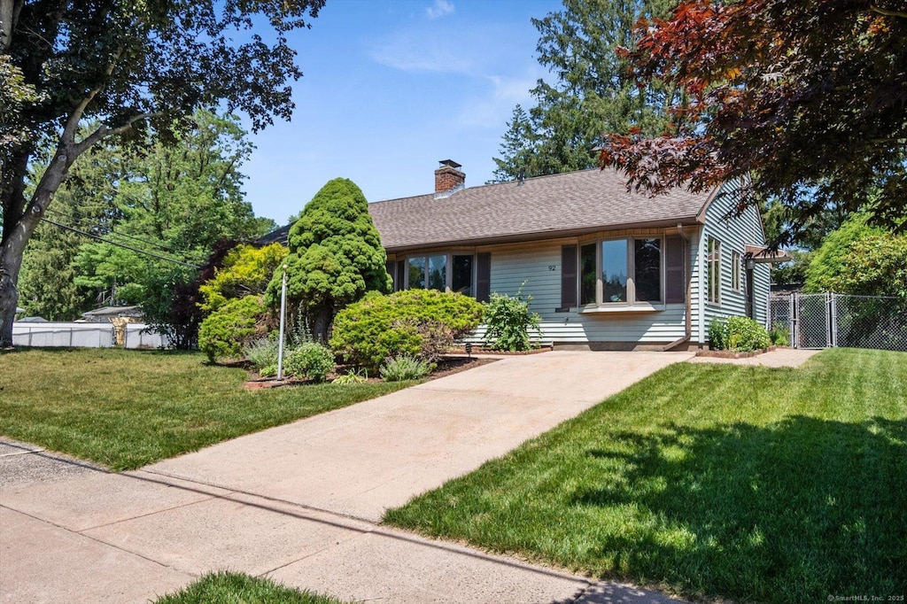 92 Manor Cir E, Hartford, CT 06118 - ranch-style home with a chimney and roof with shingles