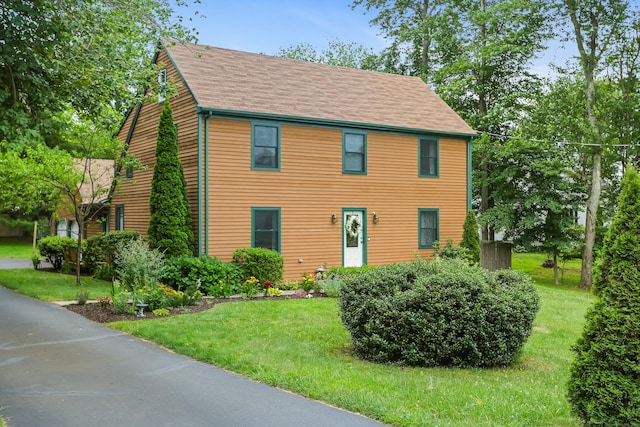 11 Park Ln, Trumbull, CT 06611 - colonial-style house featuring a front lawn and a shingled roof