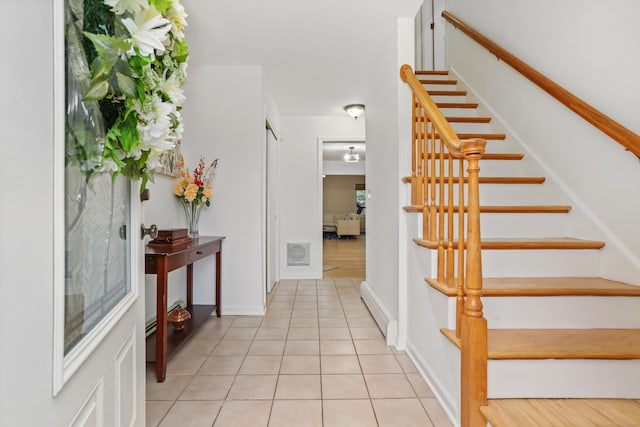 11 Park Ln, Trumbull, CT 06611 - stairway featuring tile patterned floors and a baseboard heating unit